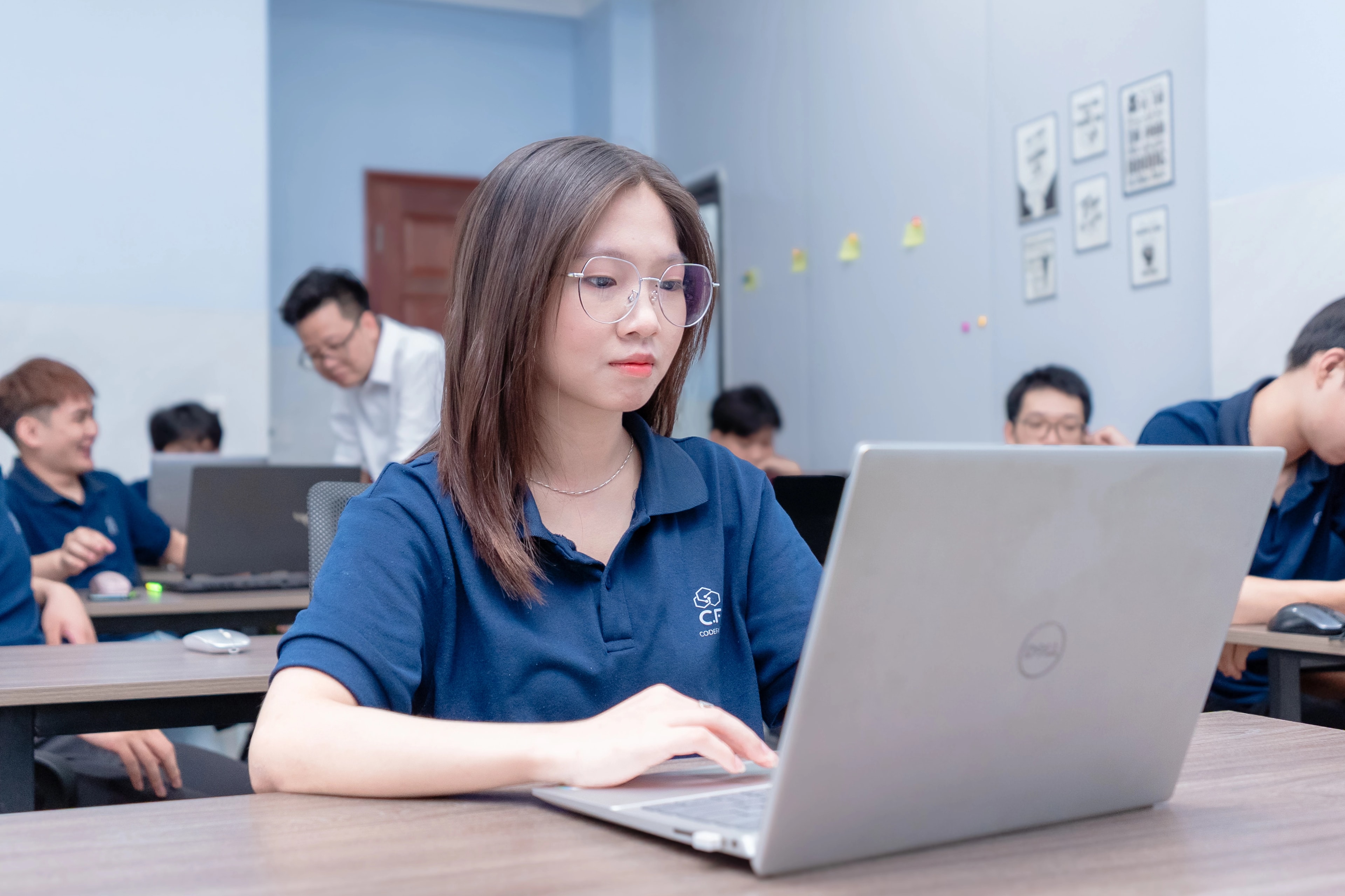 IT BA professional working at laptop in modern office